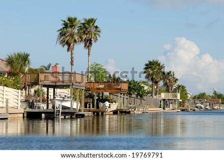Houses waterside on Padre Island, southern Texas USA