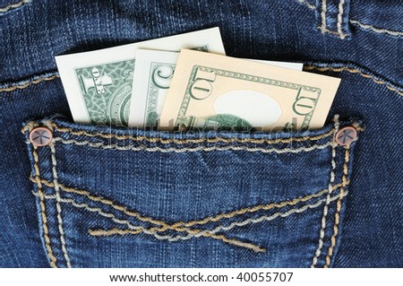 Denim jeans with money in the pocket