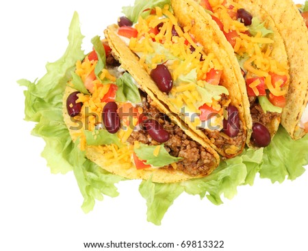 Delicious Mexican tacos isolated over white background