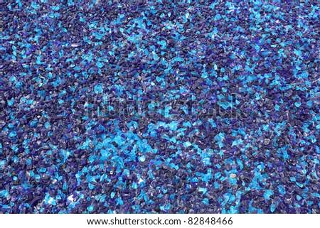 Blue crushed glass shards background