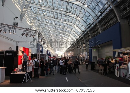 ESSEN, GERMANY - NOV 29:  Interior of a hall at the Essen Motor Show in Essen, Germany, on November 29, 2011