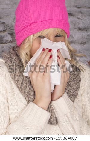 Model Released. Attractive Young Woman Sneezing