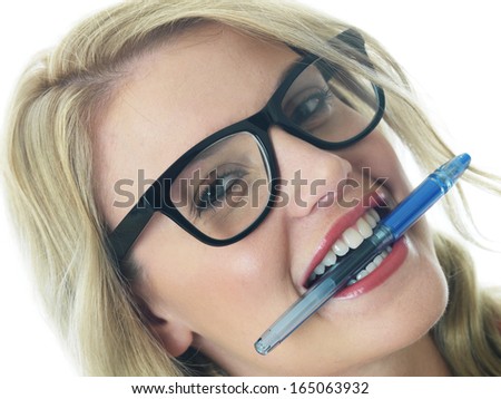 Young Business Woman Holding a Pen in Mouth