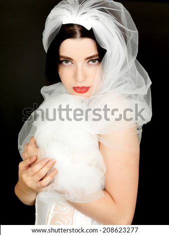 Sexy Young Woman Wearing Lingeire and a Wedding Veil