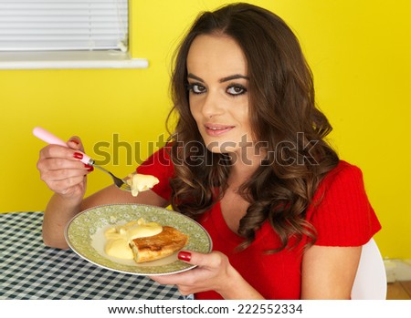 Attractive Young Woman Eating Apple Pie and Custard