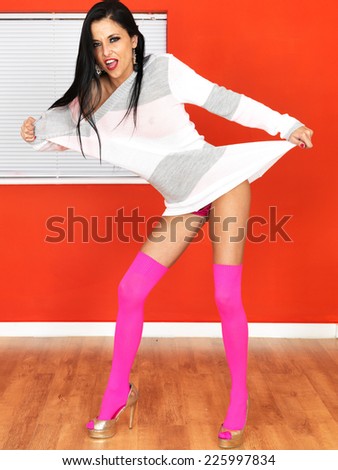 Sexy Young Pin Up Model Wearing Jumper and Pink Knee Socks