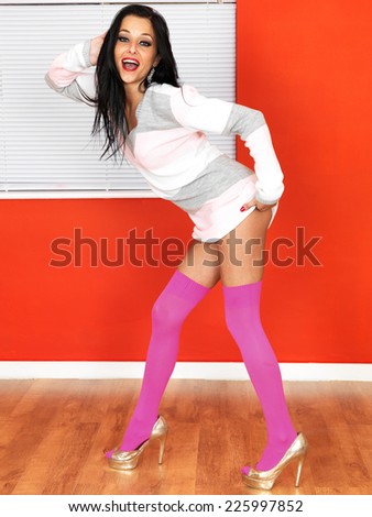 Sexy Young Pin Up Model Wearing Jumper and Pink Knee Socks