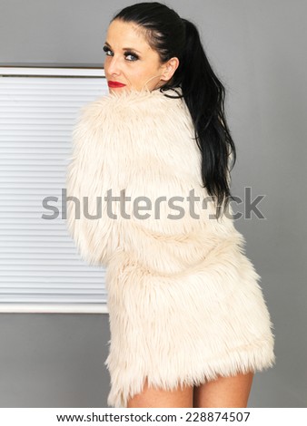 Beautiful Young Woman Wearing a Fur Jacket
