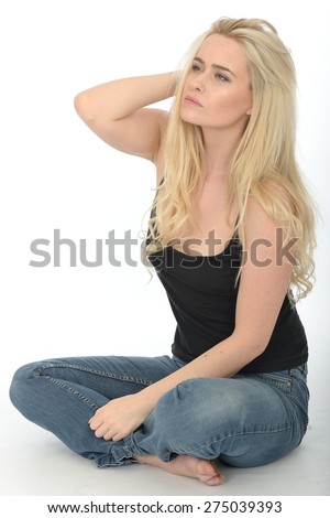 Attractive Young Woman in Her Twenties Sitting on the Floor looking Guilty Worried and Fearful