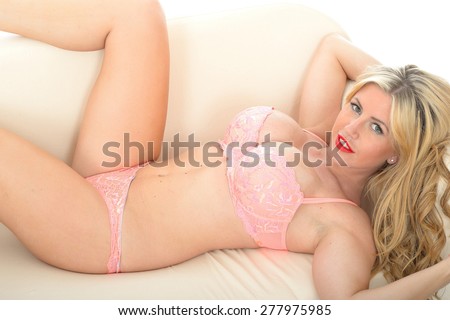 Beautiful Attractive Sexy Young Woman Posing Pin Up in Seductive Feminine Coral Lingerie Against White Background