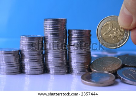 Coin piles with euro coins in closeup.
