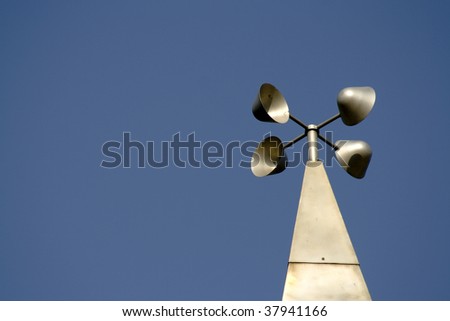 Wind meter against a blue sky (Clipping Path included)