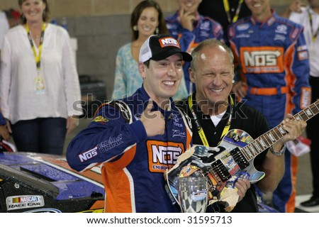 GLADEVILLE, TN - JUNE 6:Kyle Busch with Sam Bass and trophy in Victory Lane at the Federated Auto Parts 300 at Nashville Superspeedway, June 6, 2009