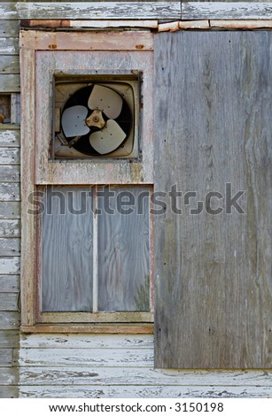 An Old Wood Wall With An Exhaust Fan
