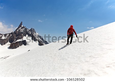 A male mountaineer on the way for reach the summit. Dent du Geant, Mont Blanc, Chamonix, France.