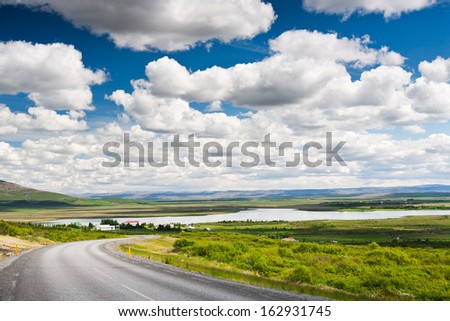 Icelandic countryside landscape in summer season. Bright summer day with nice puffy clouds. Laugarvatn lake, west Iceland.