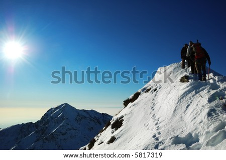 Group of mountaineers climbing a mountain Ridge, west Alps