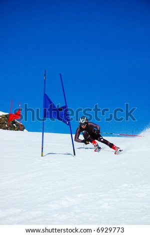 Young ski racer doing downhill slalom