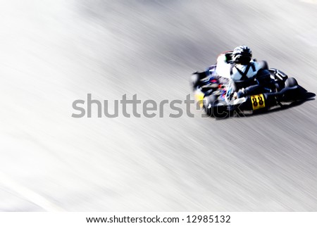 stock photo : Panning shot of a go-kart racer. Horizontal orientation.