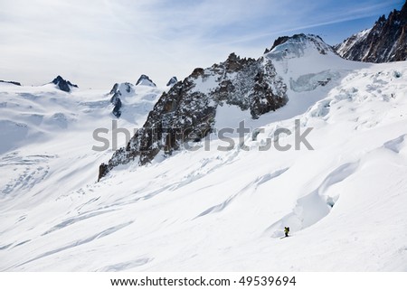 Male skier moving down in snow powder; envers du plan, vall?e blanche, Chamonix, Mont Blanc massif, France, Europe.