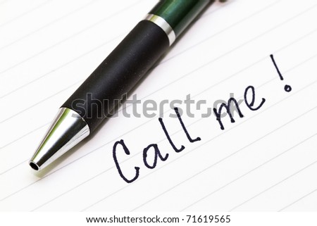 Call Me Sign written on white paper with ball pen