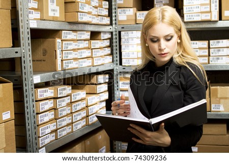 Sexy young woman doing inventory studio shot