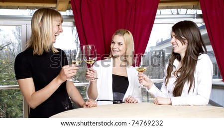 Girls having drink in bar