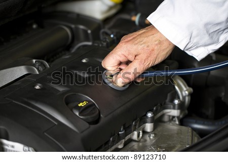 Car doctor hand at the car shop