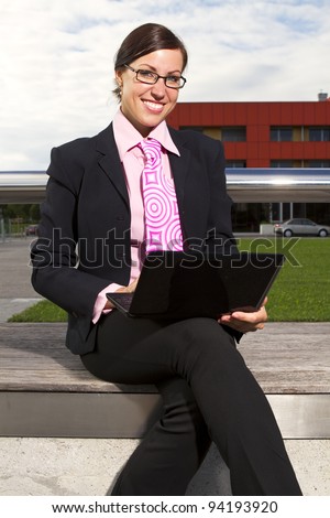Business woman in the tie suit