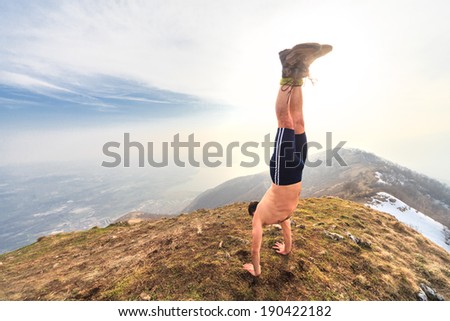 man in equilibrium in the top of the mountain