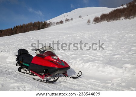 snowmobile in winter mountain