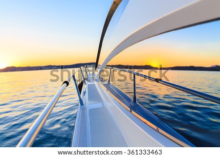 motor yacht at sunset