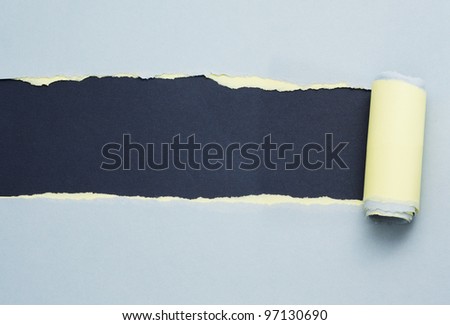 Torn blue and yellow paper with space for text with gray background