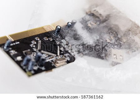 frozen electonics board for computer in ice