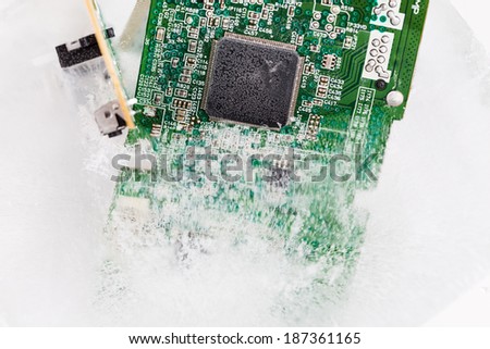 frozen electonics board for computer in ice