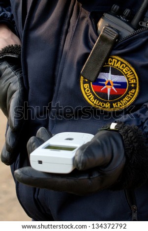 BOLSOI KAMEN, RUSSIA, - APRIL 2, 2013: Military exercises on emergency response in case of accidents at radiation-hazardous objects, Bolsoi Kamen, Russia, April 2, 2013. Radiation dosimeter.