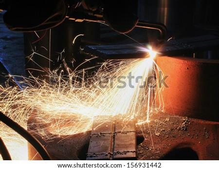 sparks from are sharp metal of the gas-flame sharp