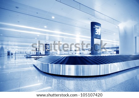 Single suitcase alone on airport carousel