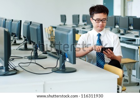 Asian man in front of the computer work