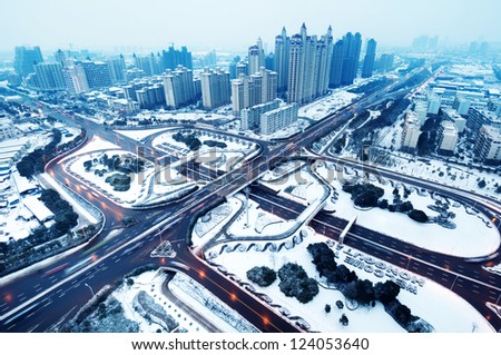 Snow, Aerial modern city highway and viaduct.