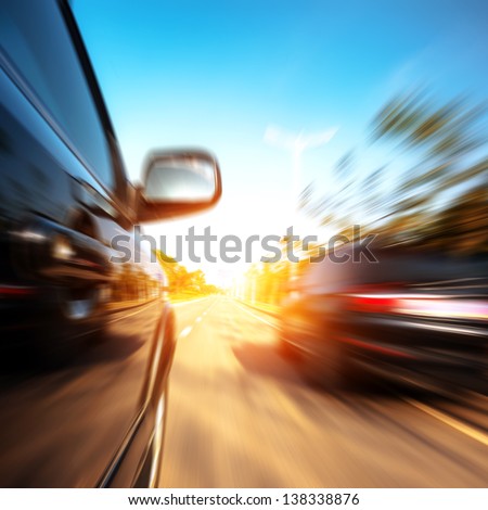 A Car Driving On A Motorway At High Speeds, Overtaking Other Cars