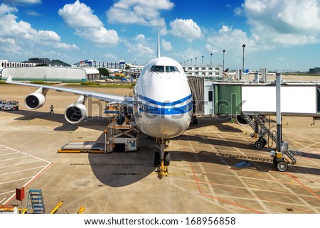 Parked aircraft on shanghai airport through the gate window.