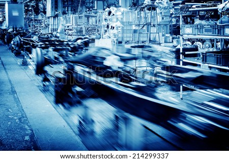 Factory floor, car production line, motion blur picture.