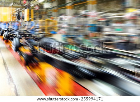 actory floor, car production line, motion blur picture.