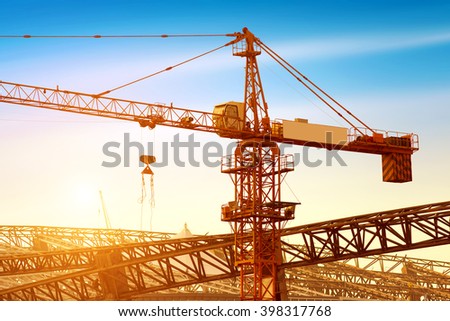Construction sites, cranes and huge steel structure.