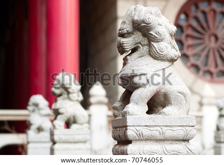 Stone lions in front of classical architecture