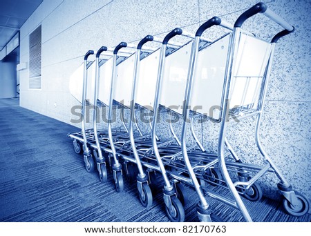 Luggage carts inside modern international airport