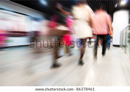 abstract zooming passengers in subway