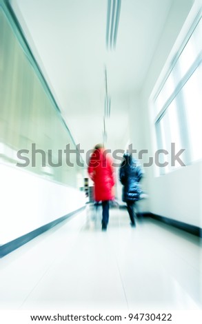 Crowd walking in a corridor