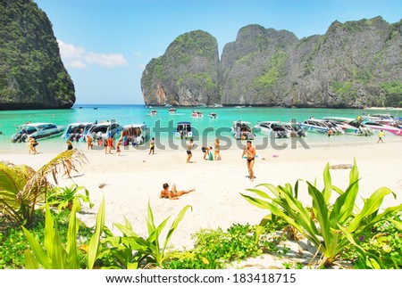 PHI PHI ISLAND, THAILAND - JUN 22: Tourists enjoy the wonderful beach, June 22, 2009 in Phi Phi Island, Thailand. It was populated by Muslim fishermen during 1940s, then became a coconut plantation
